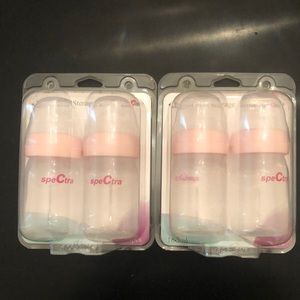 Two sets of Spectra storage bottles